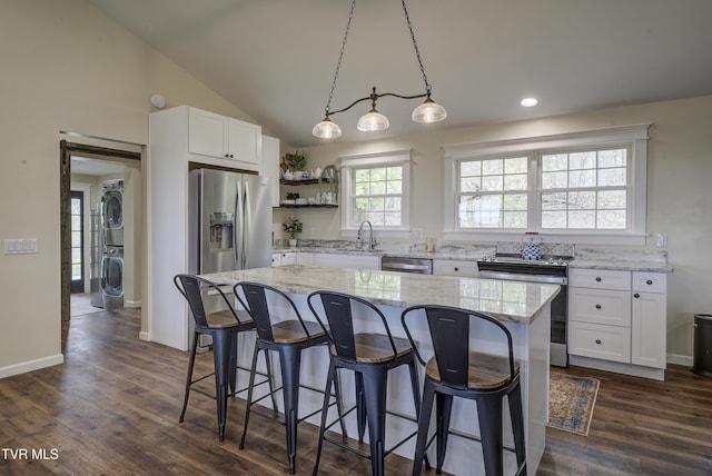 368 New Hope Rd, Jonesborough, TN 37659 - kitchen featuring stainless steel appliances, stacked washer / drying machine, open shelves, white cabinets, and recessed lighting