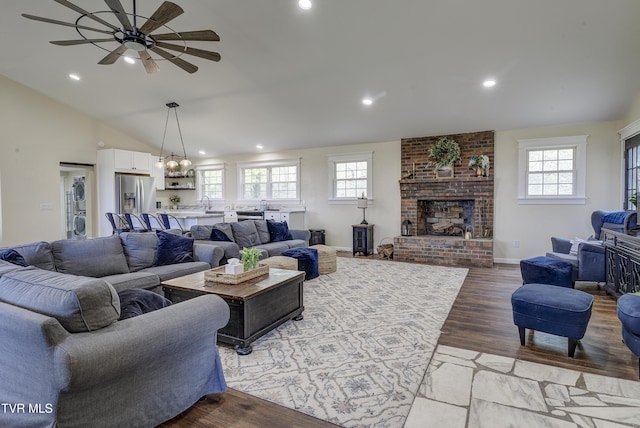 368 New Hope Rd, Jonesborough, TN 37659 - living room with a ceiling fan, vaulted ceiling, light wood-type flooring, a brick fireplace, and recessed lighting
