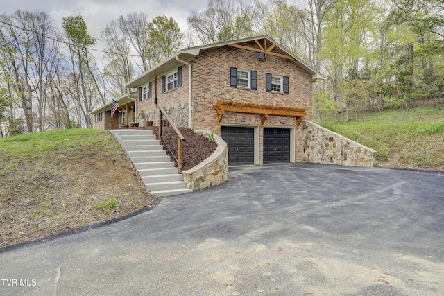 368 New Hope Rd, Jonesborough, TN 37659 - view of front facade featuring a garage, asphalt driveway, brick siding, and stairway