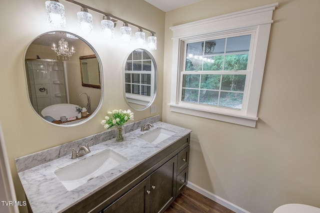 368 New Hope Rd, Jonesborough, TN 37659 - bathroom with a chandelier, double vanity, wood finished floors, and a shower