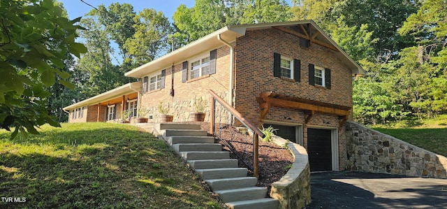 368 New Hope Rd, Jonesborough, TN 37659 - split level home featuring asphalt driveway, brick siding, an attached garage, and stairs