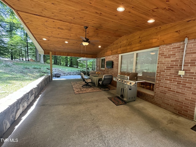 view of patio with area for grilling and ceiling fan