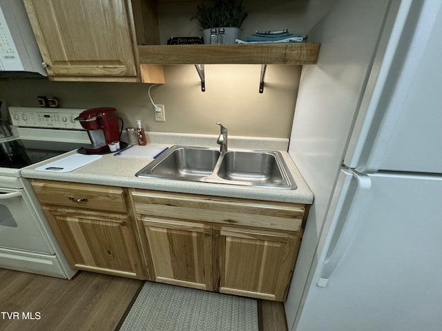 kitchen with open shelves, wood finished floors, a sink, white appliances, and light countertops