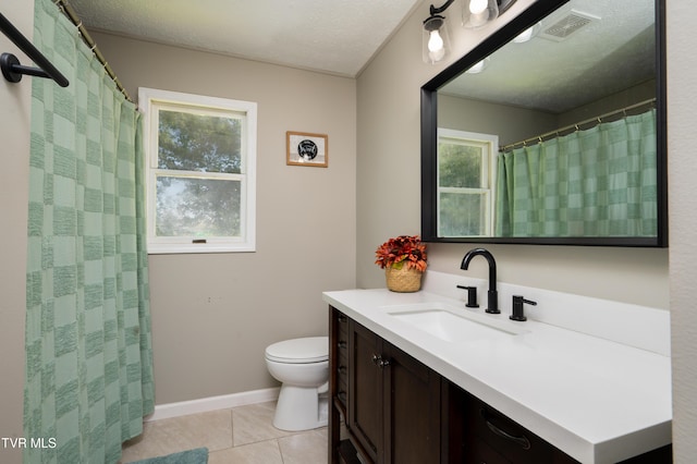 full bathroom featuring tile patterned flooring, plenty of natural light, visible vents, and toilet