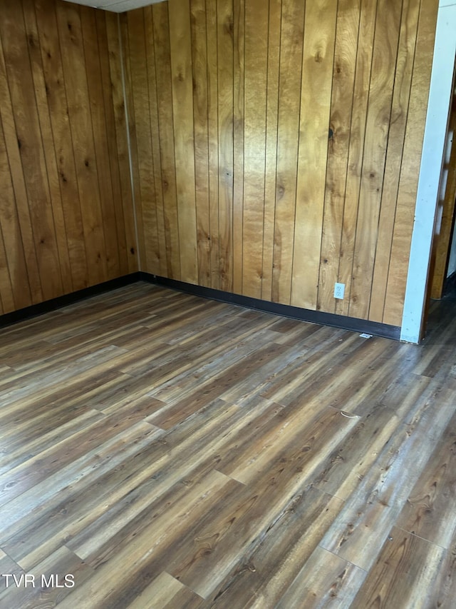 604 E Church Hill St, Greeneville, TN 37745 - empty room with wood walls and wood finished floors