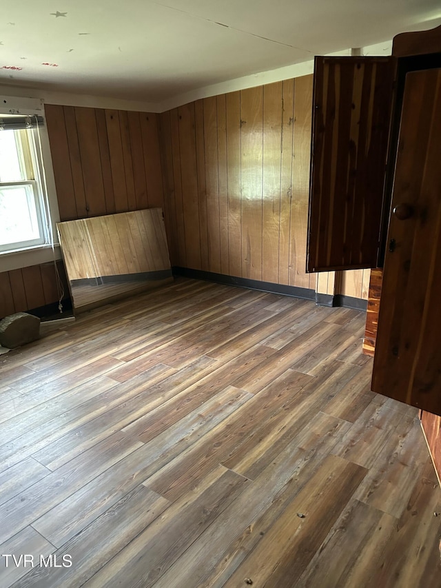 604 E Church Hill St, Greeneville, TN 37745 - empty room featuring wood walls and wood finished floors