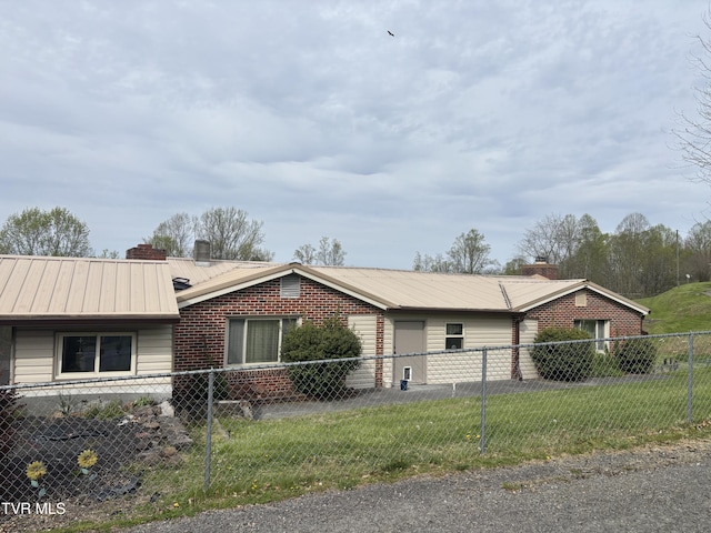 490 Delaney Ln, Clintwood, VA 24228 - view of side of home featuring a chimney, metal roof, and fence private yard