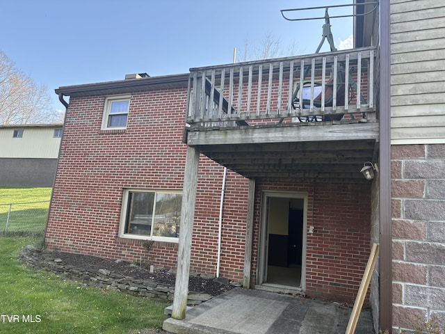 490 Delaney Ln, Clintwood, VA 24228 - exterior space featuring brick siding, fence, and a balcony