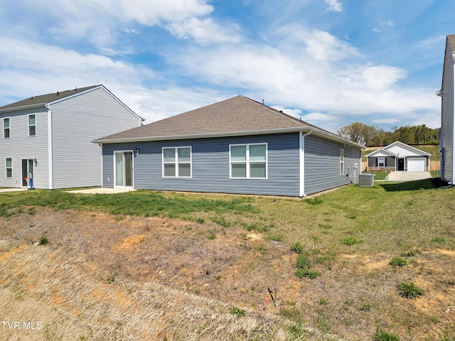 1245 Cherry Grv, Greeneville, TN 37745 - back of property featuring a shingled roof, a yard, and central AC