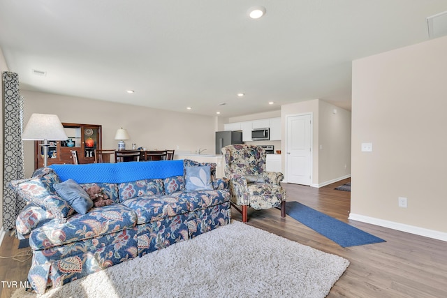 1245 Cherry Grv, Greeneville, TN 37745 - living room with wood finished floors, baseboards, and recessed lighting