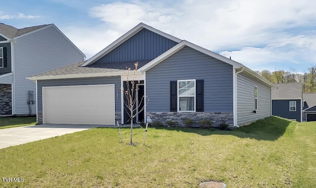 1245 Cherry Grv, Greeneville, TN 37745 - view of front facade featuring concrete driveway, a garage, a front lawn, board and batten siding, and stone siding