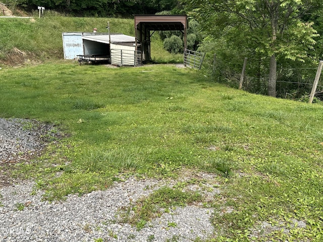 1456 Osbornes Gap Rd, Clintwood, VA 24228 - view of yard featuring a detached carport, an outbuilding, and an outdoor structure