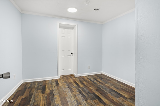 1219 Ledford St, Elizabethton, TN 37643 - spare room featuring crown molding, wood finished floors, and baseboards
