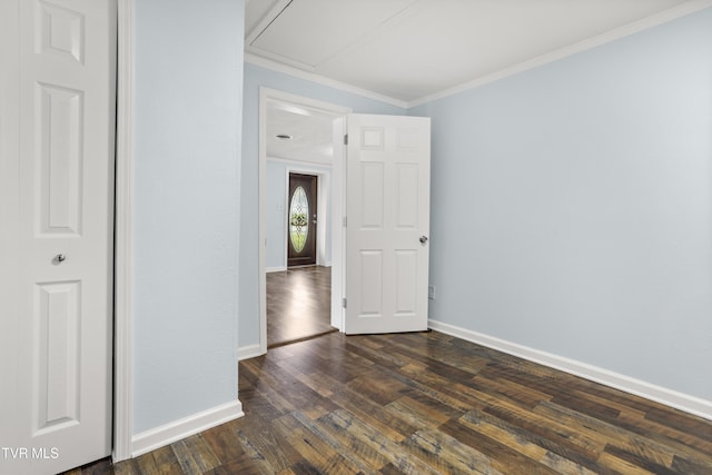 1219 Ledford St, Elizabethton, TN 37643 - unfurnished bedroom featuring dark wood-style flooring, crown molding, baseboards, and attic access