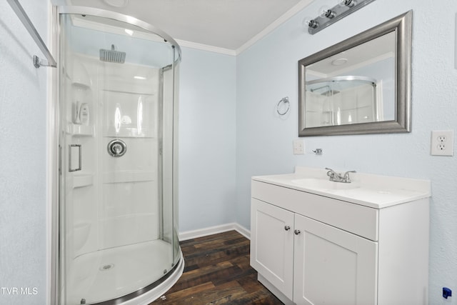 1219 Ledford St, Elizabethton, TN 37643 - full bathroom with a shower stall, crown molding, vanity, wood finished floors, and baseboards