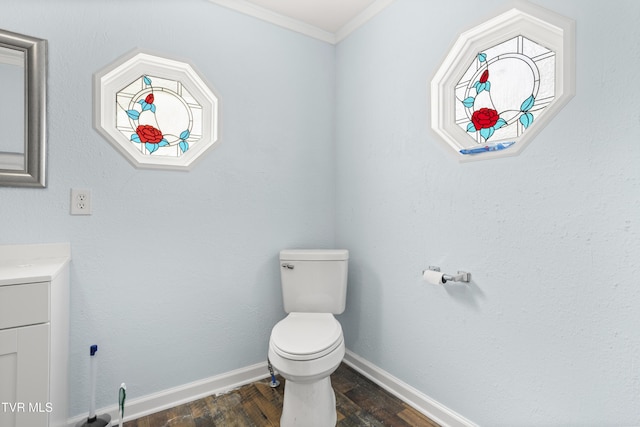 1219 Ledford St, Elizabethton, TN 37643 - half bath featuring ornamental molding, wood finished floors, vanity, toilet, and baseboards