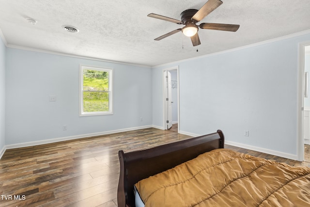 1219 Ledford St, Elizabethton, TN 37643 - bedroom featuring wood-type flooring, a textured ceiling, ornamental molding, baseboards, and a ceiling fan