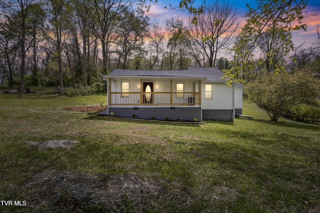 1219 Ledford St, Elizabethton, TN 37643 - view of front facade featuring covered porch, a lawn, crawl space, and a shingled roof