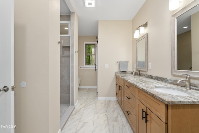 332 Tom Patterson Trl, Dandridge, TN 37725 - bathroom with double vanity, marble finish flooring, a tile shower, baseboards, and a freestanding bath
