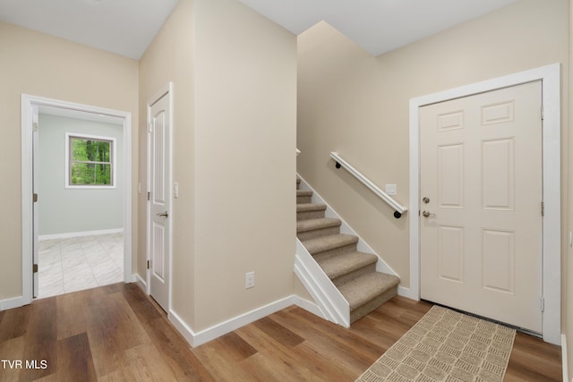 332 Tom Patterson Trl, Dandridge, TN 37725 - entrance foyer featuring wood finished floors, stairs, and baseboards