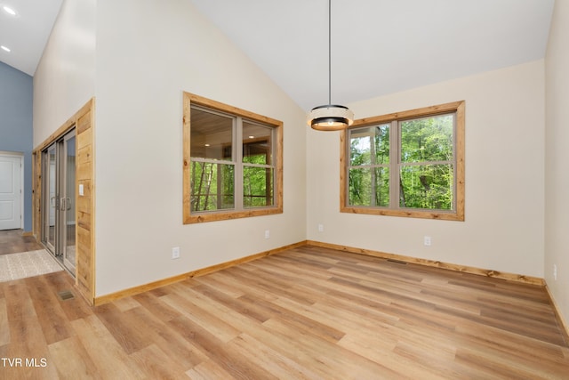 332 Tom Patterson Trl, Dandridge, TN 37725 - empty room featuring wood finished floors, baseboards, high vaulted ceiling, and recessed lighting