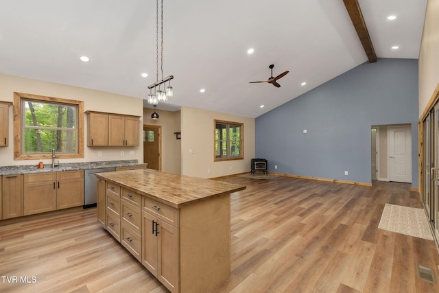 332 Tom Patterson Trl, Dandridge, TN 37725 - kitchen with stainless steel dishwasher, a sink, healthy amount of natural light, beamed ceiling, and a center island
