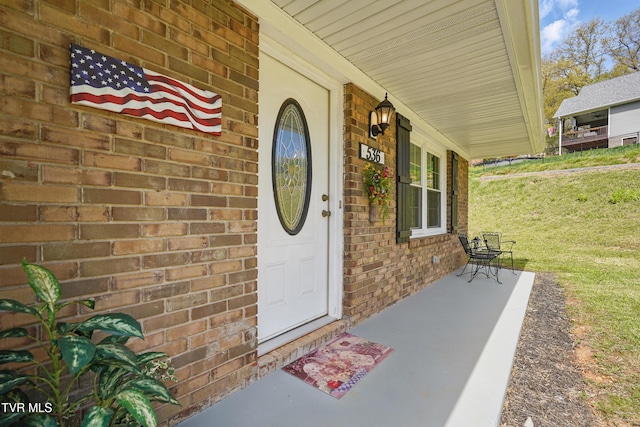 536 Chadwell Rd, Kingsport, TN 37660 - doorway to property with brick siding and covered porch
