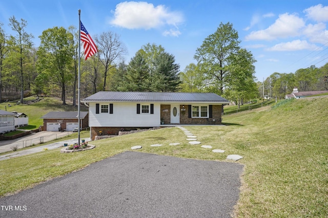 536 Chadwell Rd, Kingsport, TN 37660 - view of front of home with a porch, an outdoor structure, a front yard, and metal roof