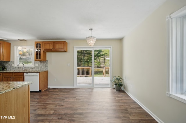 536 Chadwell Rd, Kingsport, TN 37660 - kitchen with white dishwasher, tasteful backsplash, brown cabinetry, and dark wood-style floors