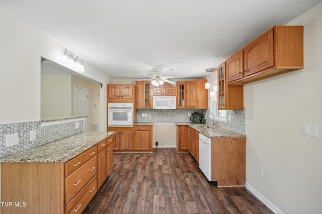 536 Chadwell Rd, Kingsport, TN 37660 - kitchen with a ceiling fan, light stone counters, a sink, white appliances, and dark wood-type flooring