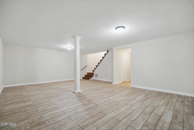 536 Chadwell Rd, Kingsport, TN 37660 - finished below grade area featuring light wood finished floors, baseboards, a textured ceiling, and stairway