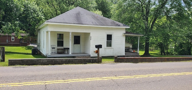 1167 Bloomingdale Pike, Kingsport, TN 37660 - view of front of home with a porch, a shingled roof, and a front lawn