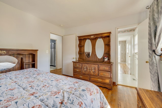 bedroom with hardwood / wood-style floors