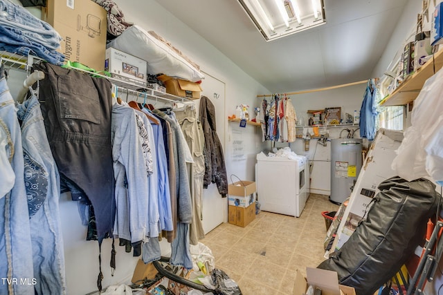 interior space featuring washing machine and clothes dryer and electric water heater