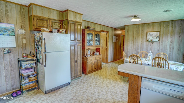 683 Ridge Rd, Piney Flats, TN 37686 - kitchen featuring white appliances, wooden walls, crown molding, light countertops, and light floors