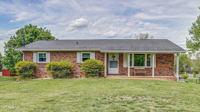 683 Ridge Rd, Piney Flats, TN 37686 - ranch-style home with a porch, roof with shingles, a front yard, and brick siding
