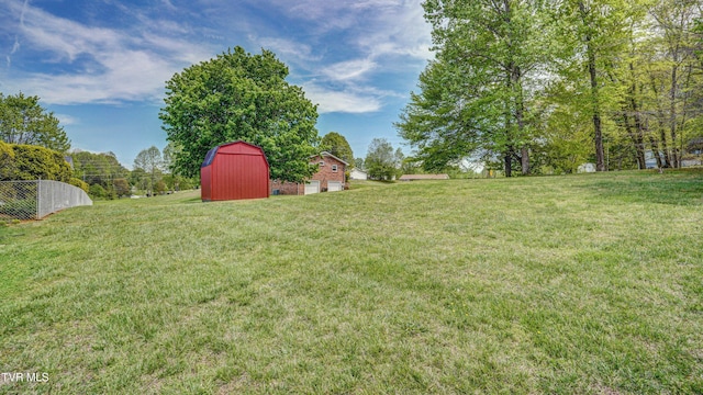 683 Ridge Rd, Piney Flats, TN 37686 - view of yard with fence, a barn, and an outbuilding