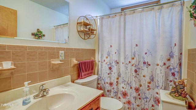 683 Ridge Rd, Piney Flats, TN 37686 - full bath with vanity, toilet, curtained shower, and tile walls