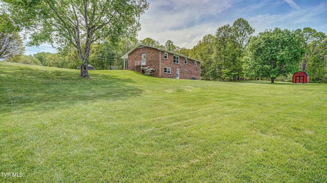683 Ridge Rd, Piney Flats, TN 37686 - view of yard featuring a shed and an outbuilding
