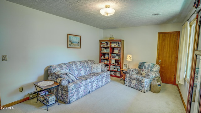 683 Ridge Rd, Piney Flats, TN 37686 - carpeted living area featuring a textured ceiling and baseboards