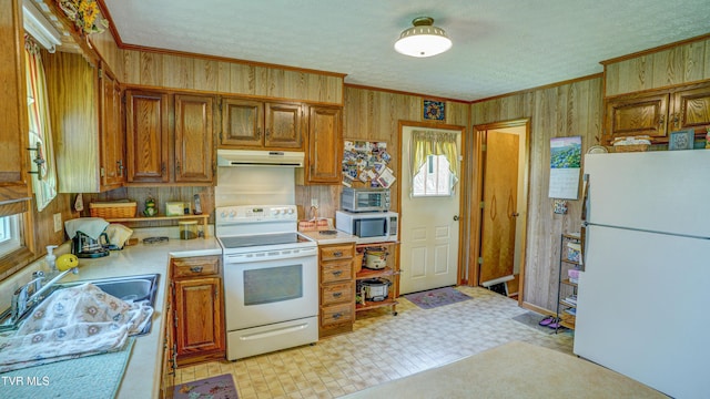 683 Ridge Rd, Piney Flats, TN 37686 - kitchen featuring brown cabinets, white appliances, light countertops, and crown molding