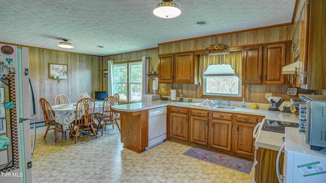 683 Ridge Rd, Piney Flats, TN 37686 - kitchen featuring brown cabinets, white appliances, crown molding, and a peninsula