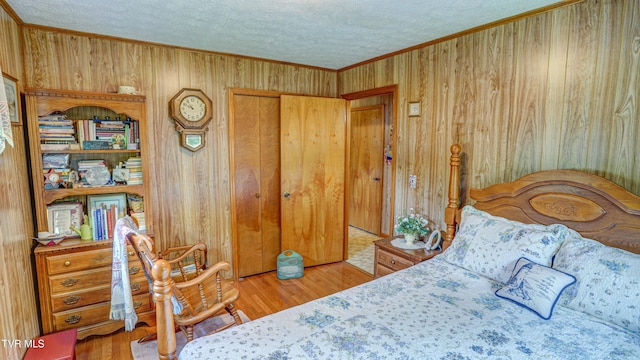 683 Ridge Rd, Piney Flats, TN 37686 - bedroom featuring wood finished floors, wooden walls, a textured ceiling, and crown molding