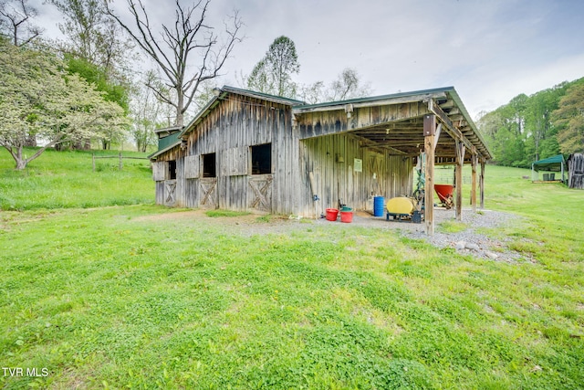 view of outbuilding featuring an outdoor structure and an exterior structure