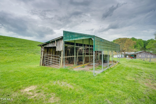view of outbuilding featuring an exterior structure and an outbuilding