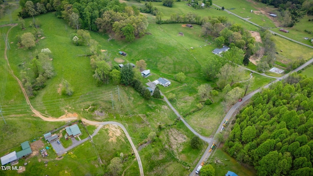 birds eye view of property featuring a rural view