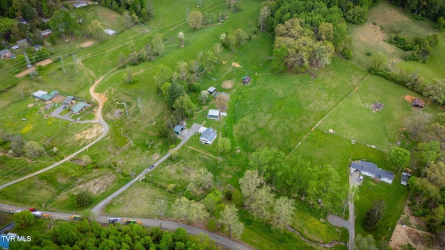 birds eye view of property featuring a rural view