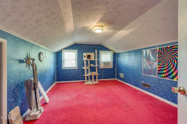 bonus room featuring carpet floors, a textured ceiling, baseboards, and lofted ceiling