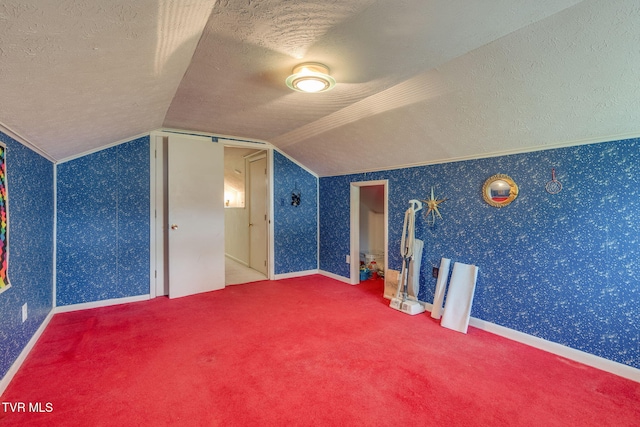 bonus room with carpet floors, a textured ceiling, and lofted ceiling