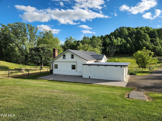 12075 Goose Creek Rd, Bristol, VA 24202 - view of side of property featuring a patio, a chimney, and a lawn